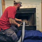 Chimney sweep cleaning a fireplace in Ashland VA